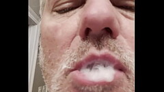 Playing with my own cum in my mouth, before swallowing it Thumb