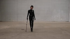 Transgender Mistress Obsidian Jones formidably wields her bullwhip whilst fully clad in black latex. Thumb